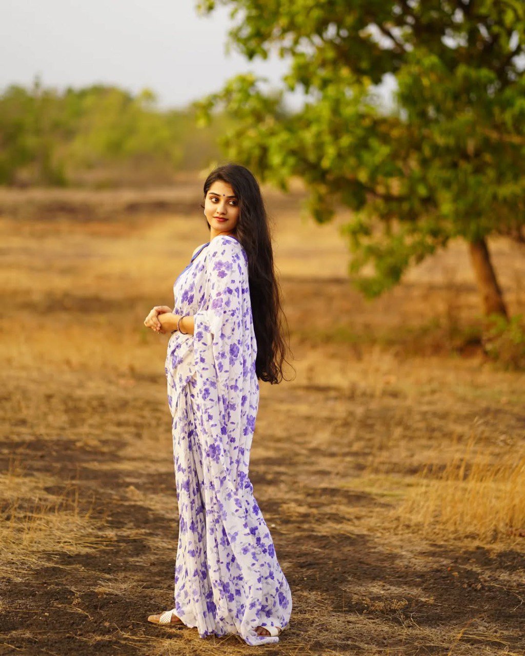 Elegant Off-White Georgette Printed Saree with Contrast Blue Blouse