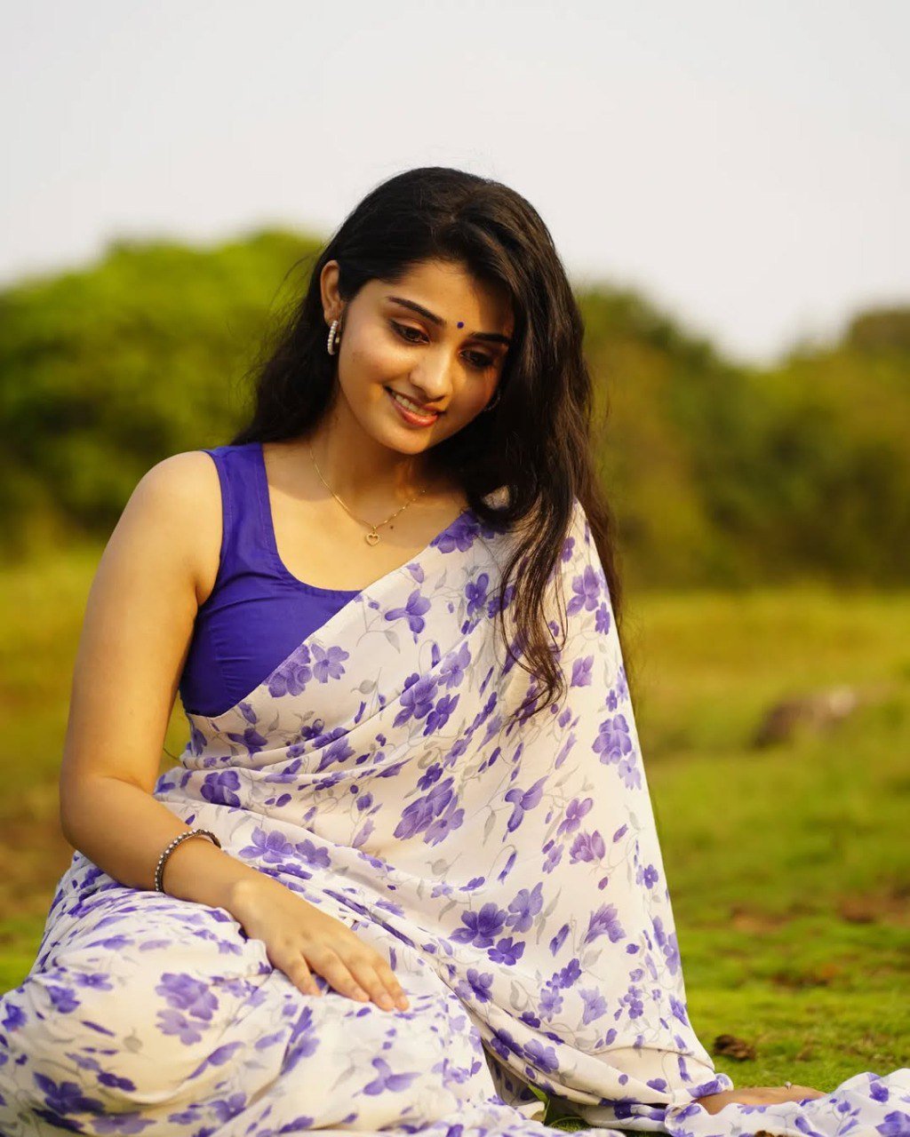 Elegant Off-White Georgette Printed Saree with Contrast Blue Blouse
