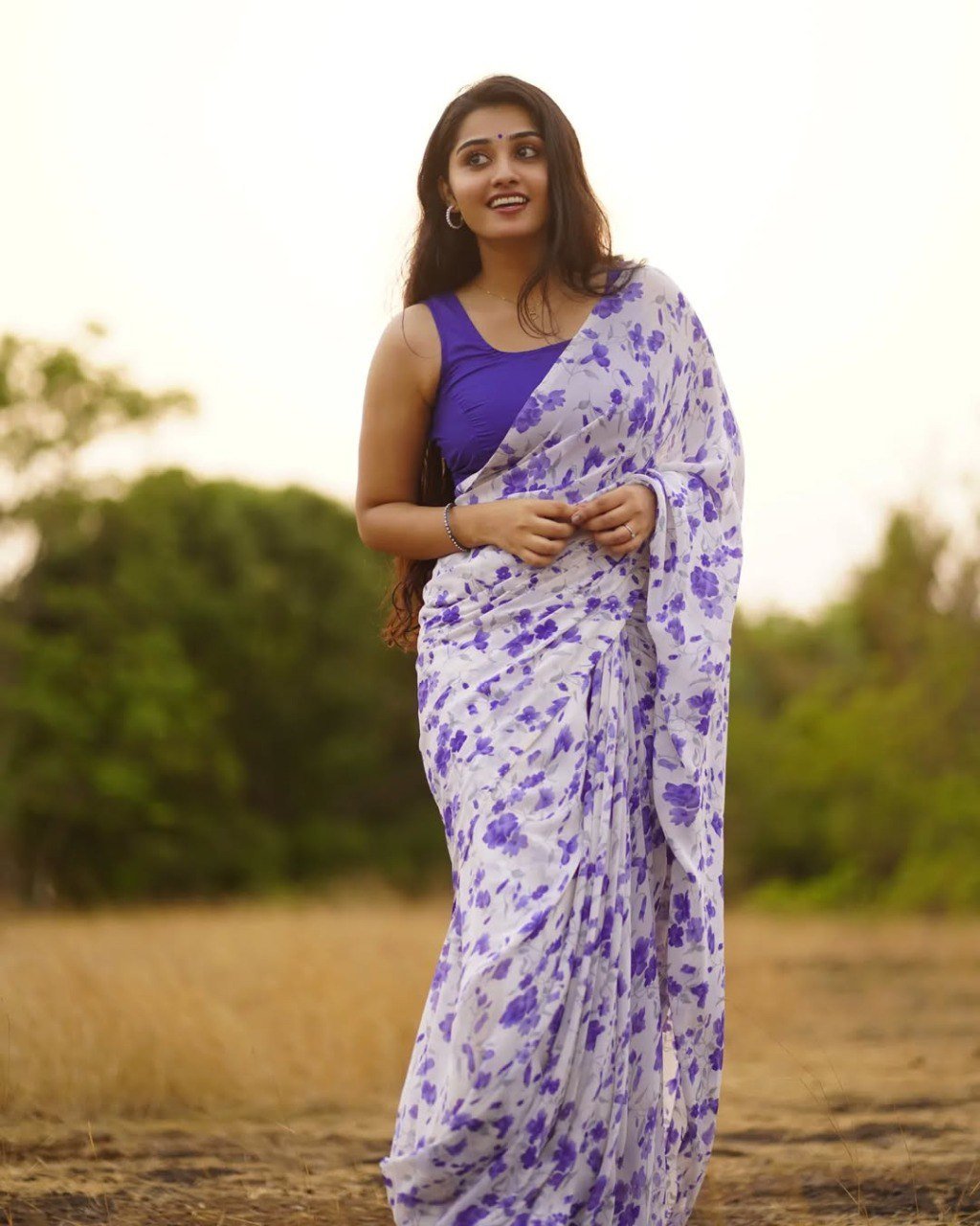 Elegant Off-White Georgette Printed Saree with Contrast Blue Blouse